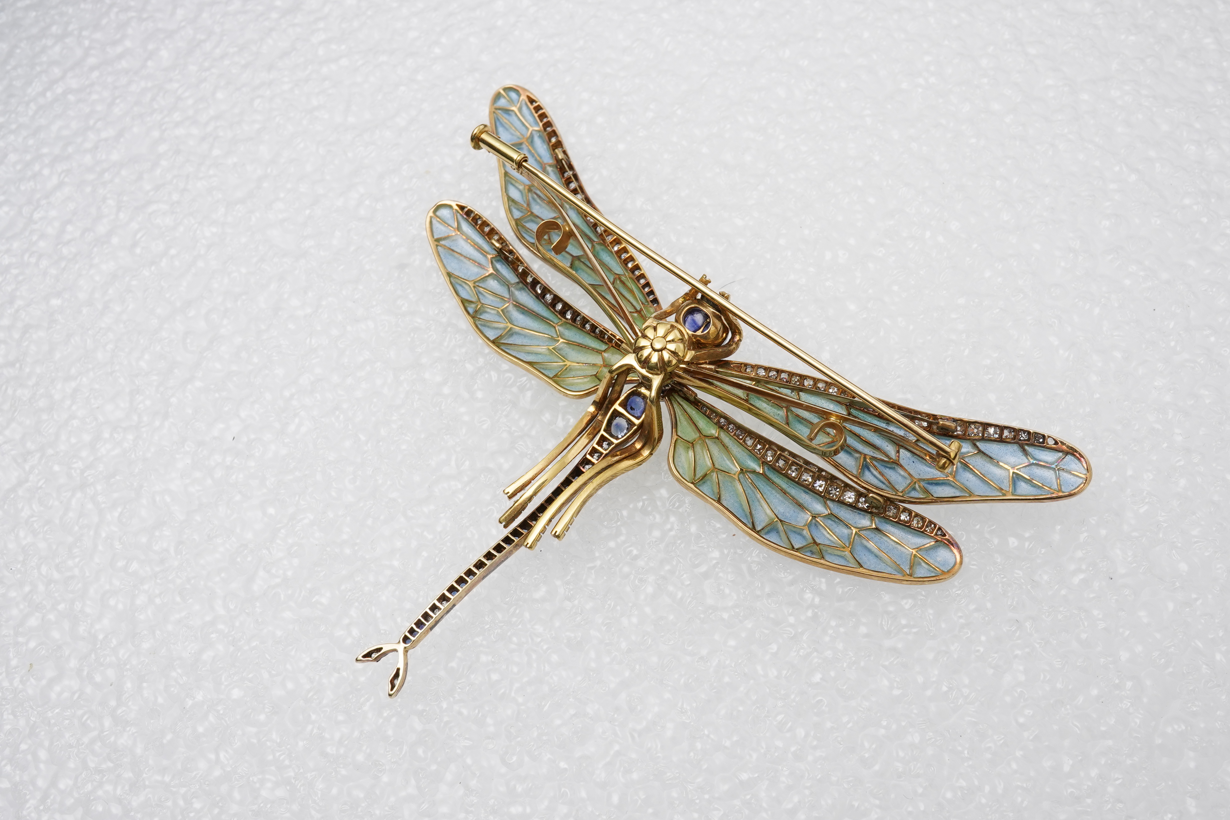 An enamel, sapphire and diamond dragonfly brooch